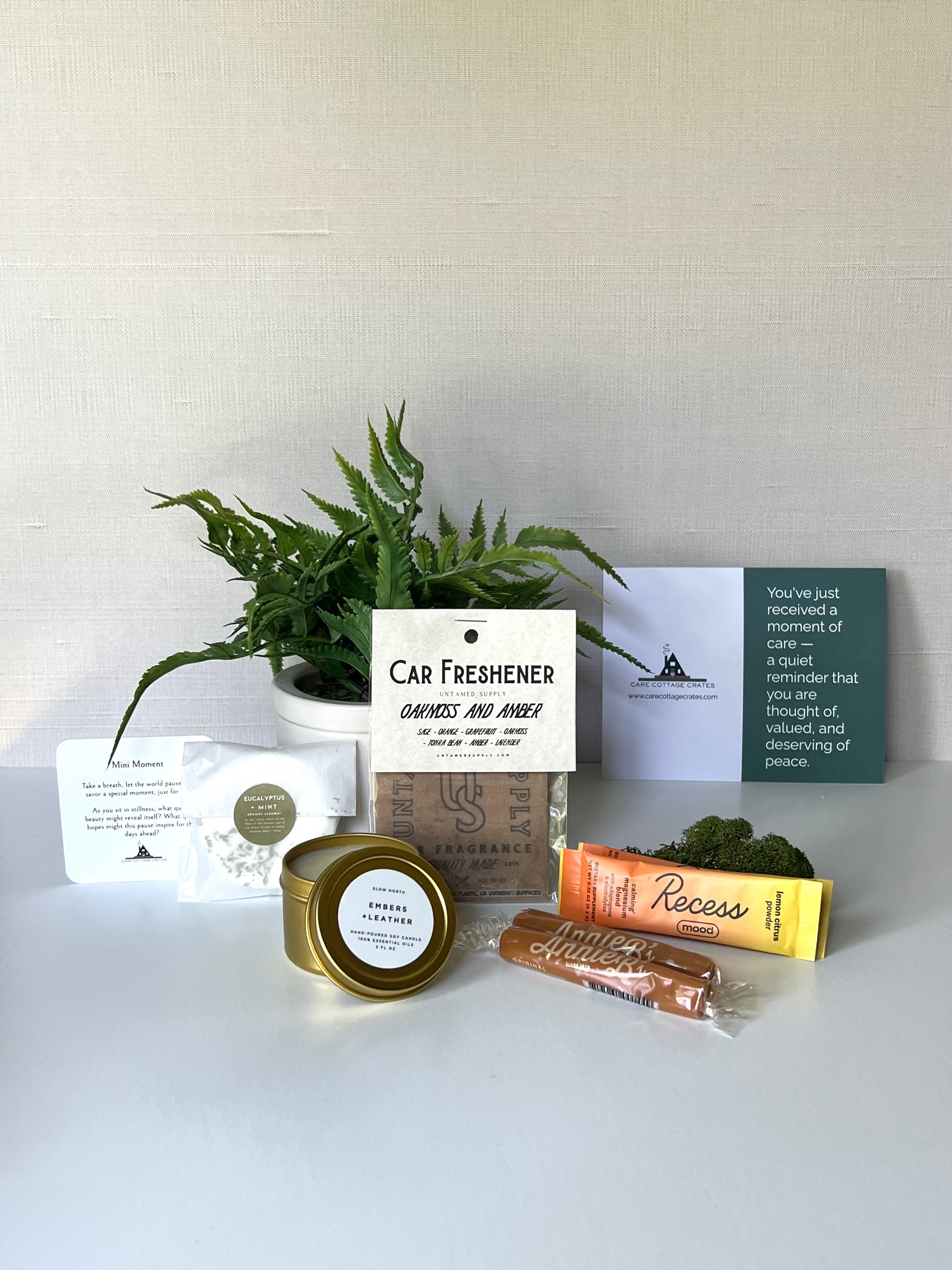 Shower steamer, car freshener, mini candle, relaxing recess drink, and caramels make for the perfect small gift for him. Includes a thoughtful prompt and custom playlist.