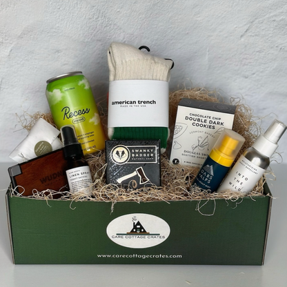 Walk in the Woods Crate with nine outdoors-inspired self-care products arranged in a gift box, including socks, drink, soap, and spray.